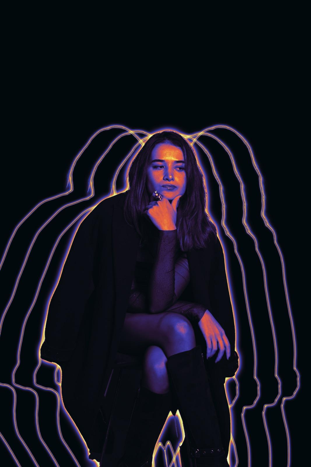 Portrait of Zeynep (Zeyno), lit in purple and orange, with glowing echo outlines